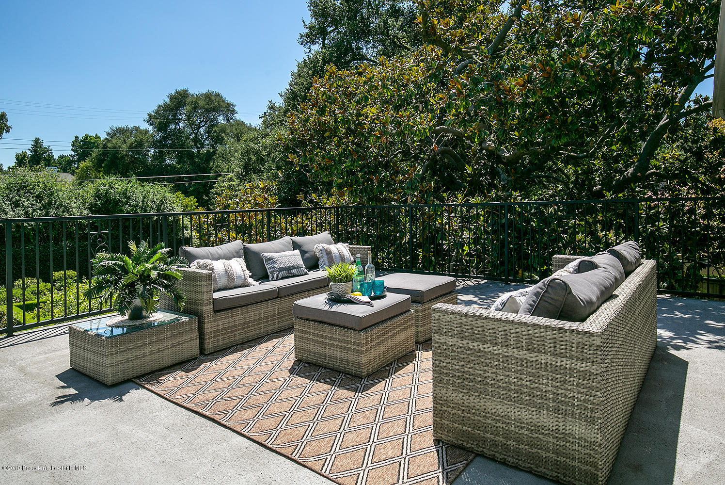 820 Arden Road Pasadena, CA 91106 - Photo 37 of 75 a view of a patio with couches chairs and a potted plant