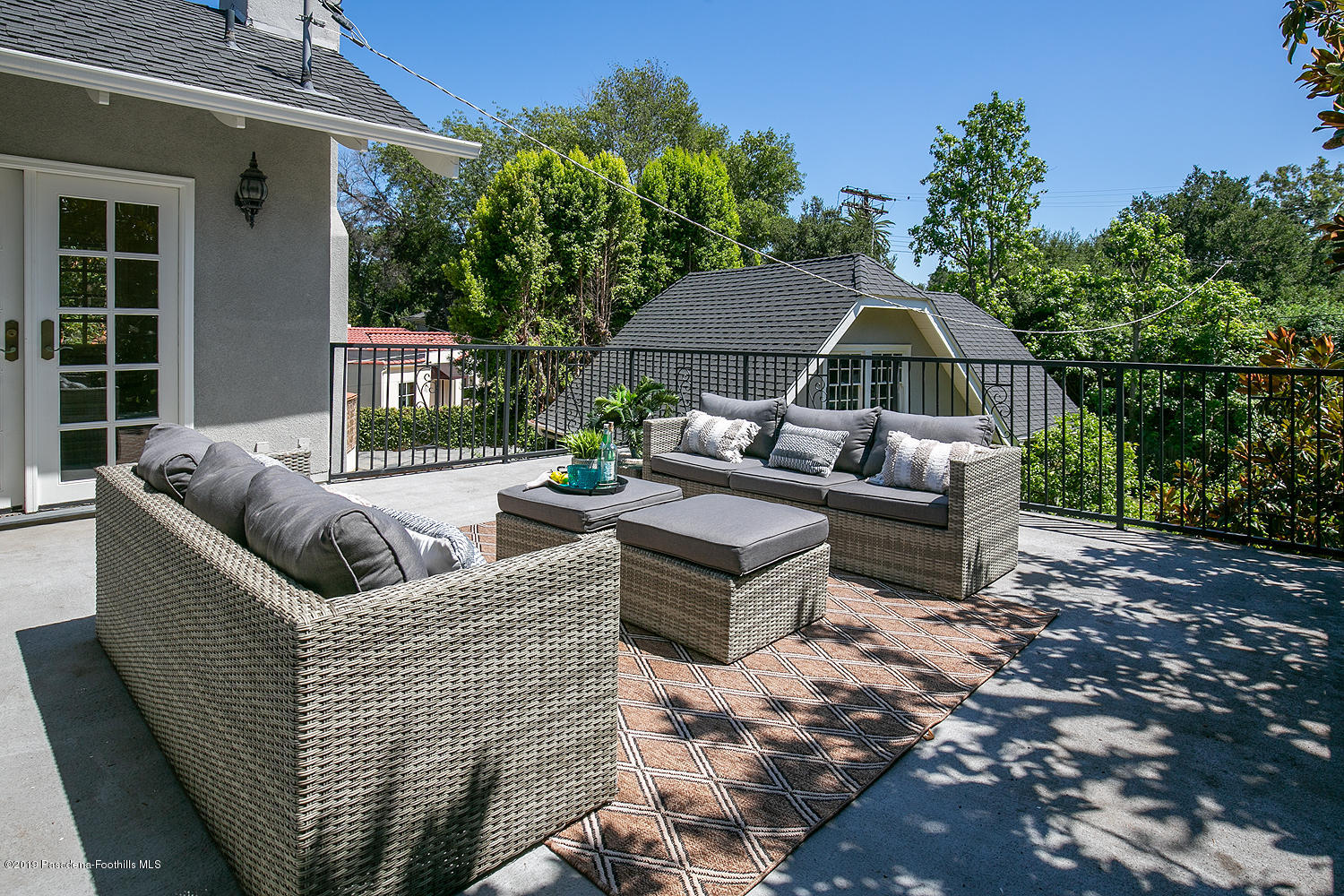 820 Arden Road Pasadena, CA 91106 - Photo 38 of 75 a view of a patio with couches table and chairs and potted plants