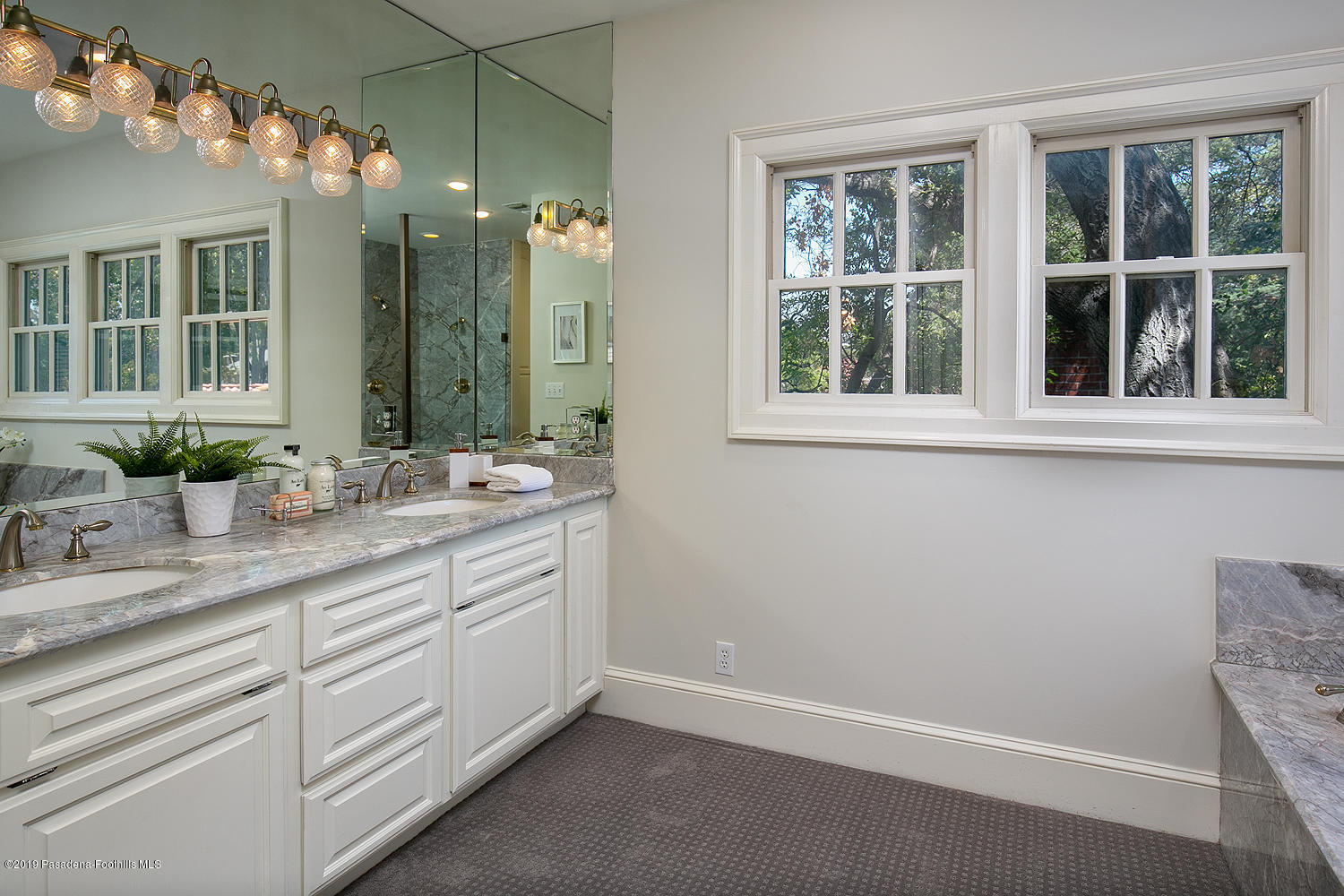 820 Arden Road Pasadena, CA 91106 - Photo 41 of 75 a bathroom with a sink vanity and a mirror