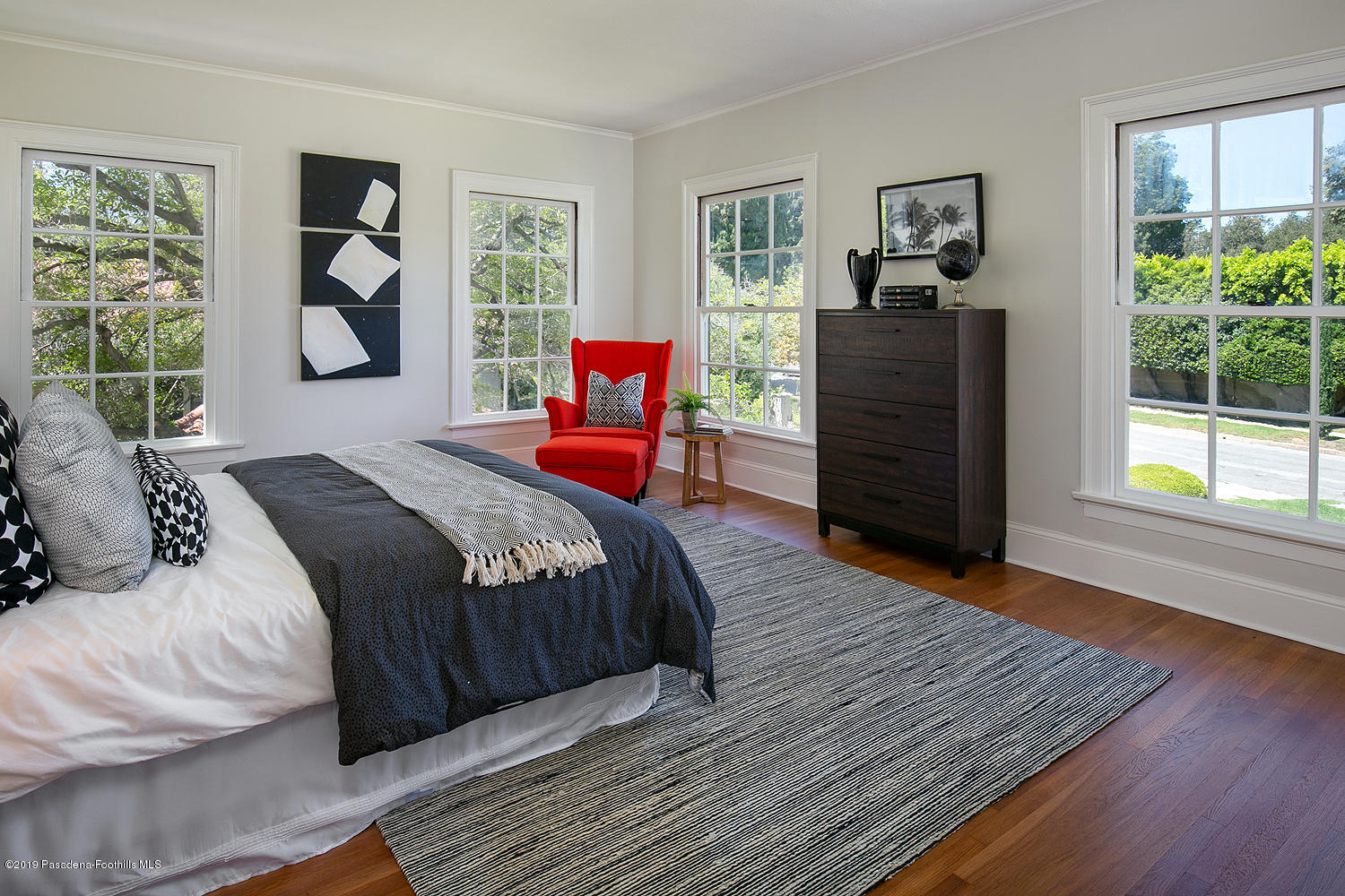 820 Arden Road Pasadena, CA 91106 - Photo 49 of 75 a bedroom with a bed and wooden floor