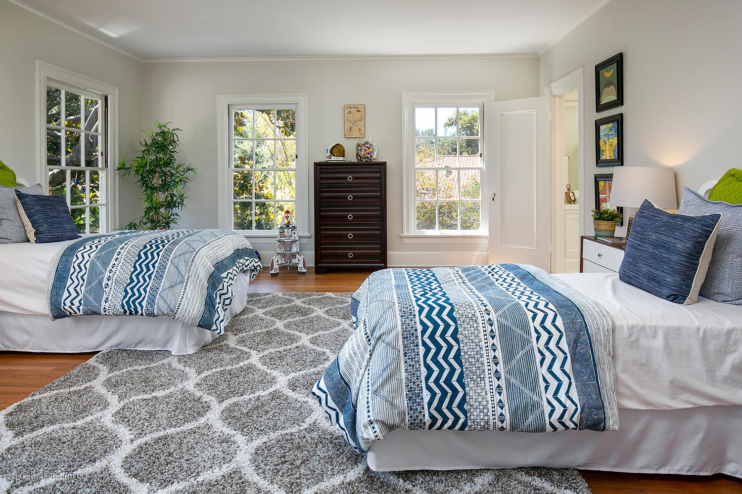 820 Arden Road Pasadena, CA 91106 - Photo 52 of 75 a bedroom with a bed and wooden floor