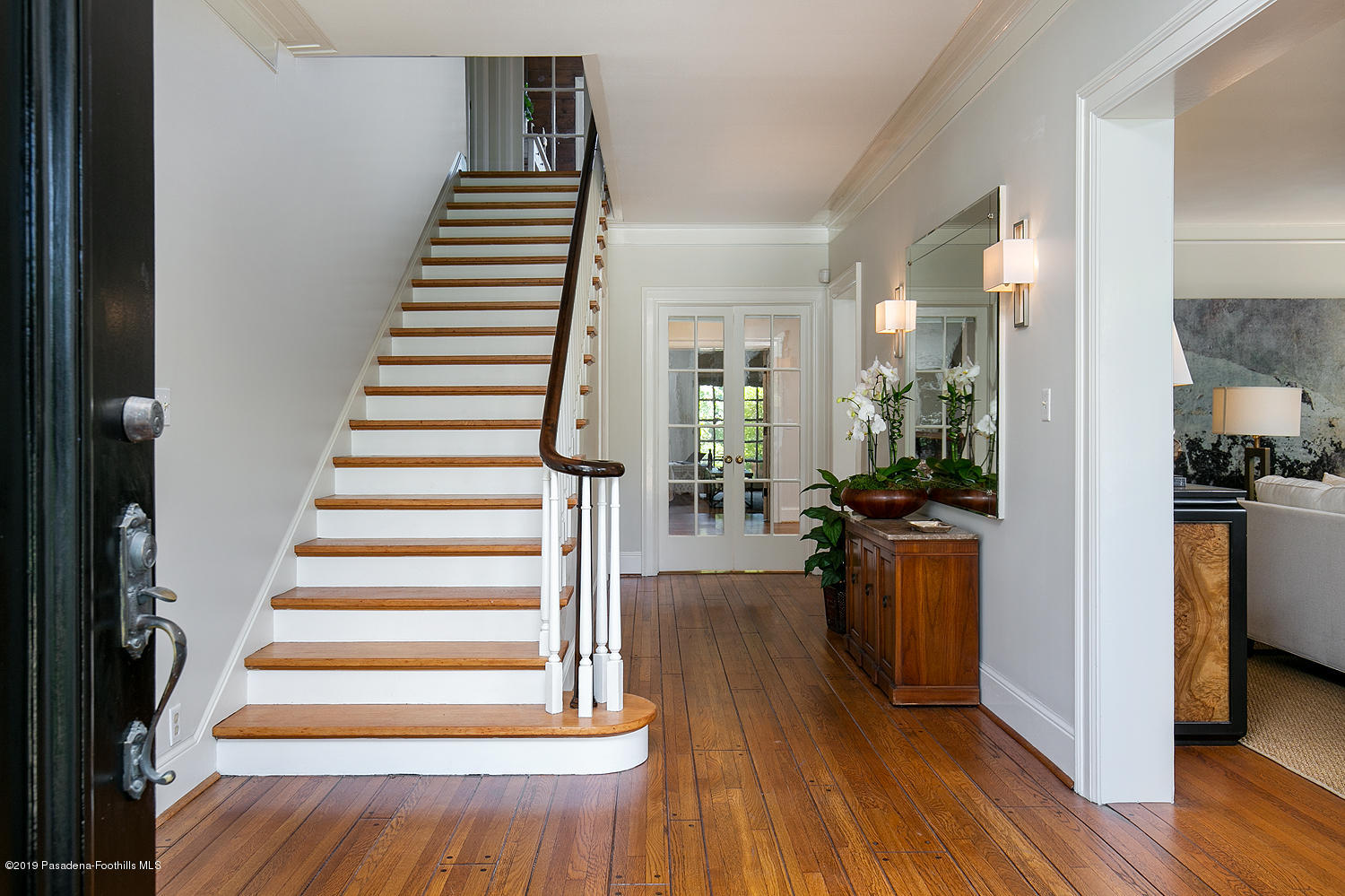 820 Arden Road Pasadena, CA 91106 - Photo 7 of 75 a view of a hallway with wooden floor and staircase