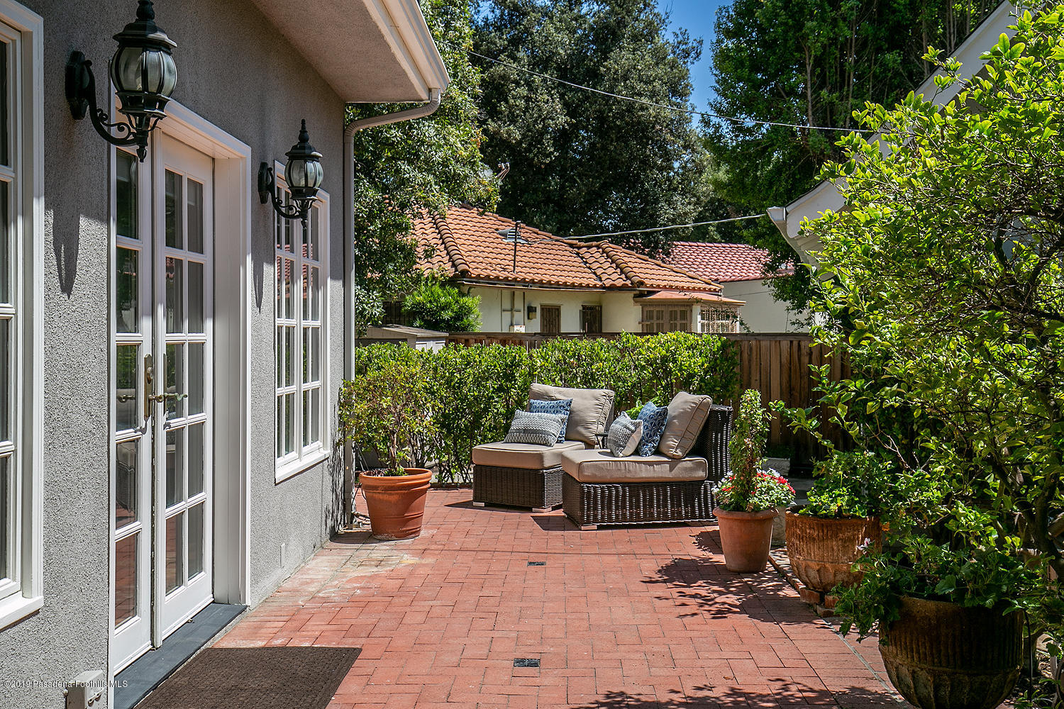 820 Arden Road Pasadena, CA 91106 - Photo 62 of 75 a view of a patio with couches chair and potted plants