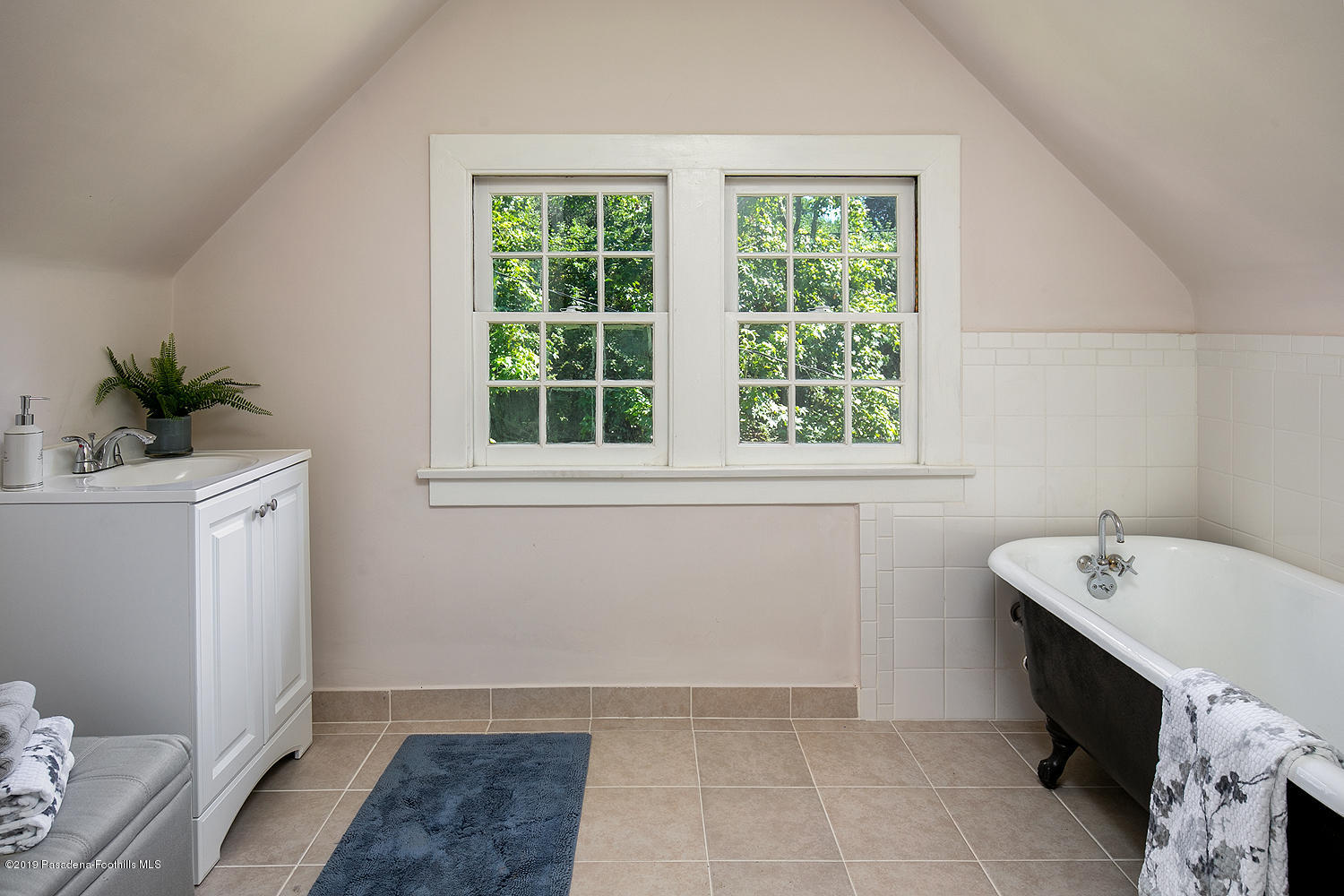 820 Arden Road Pasadena, CA 91106 - Photo 69 of 75 a bathroom with a sink a mirror and a bathtub