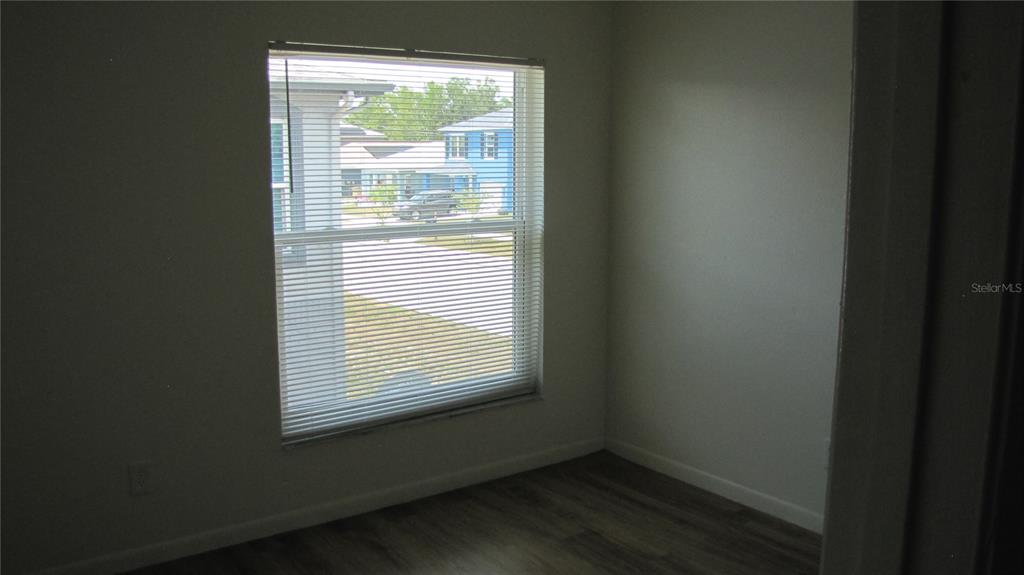 5116 East Temple Heights Road, Unit A Tampa, FL 33617 - Photo 11 of 14 a view of an empty room with a window