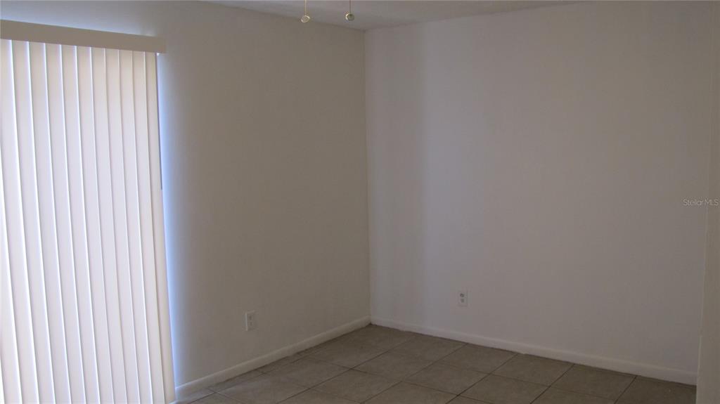 5116 East Temple Heights Road, Unit A Tampa, FL 33617 - Photo 4 of 14 a view of a small space with a window