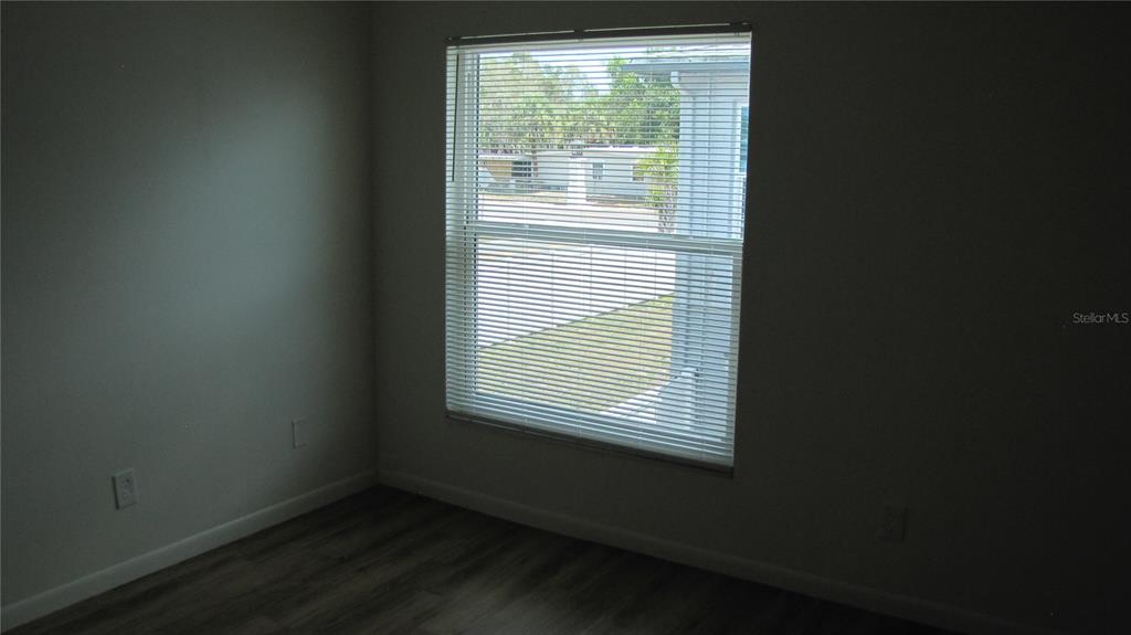 5116 East Temple Heights Road, Unit A Tampa, FL 33617 - Photo 9 of 14 a view of an empty room with a window