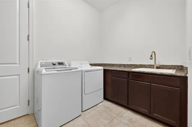 a kitchen with stainless steel appliances granite countertop a stove and a wooden cabinets
