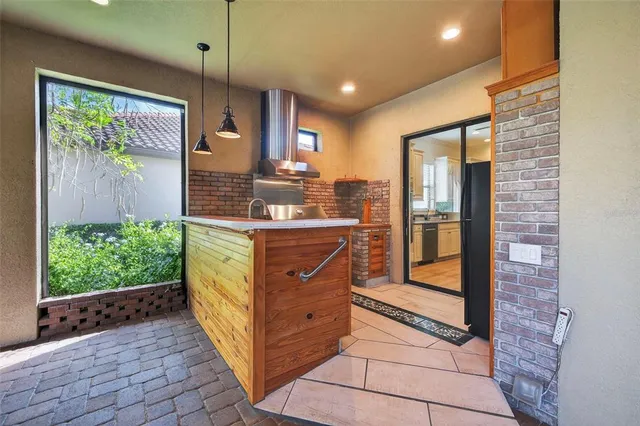 a backyard of a house with outdoor seating and green space