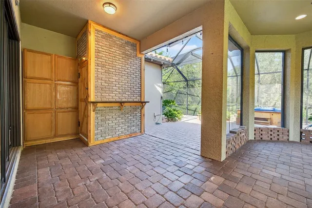 a view of a backyard with sitting area