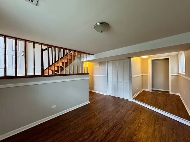 a view of room with wooden floor