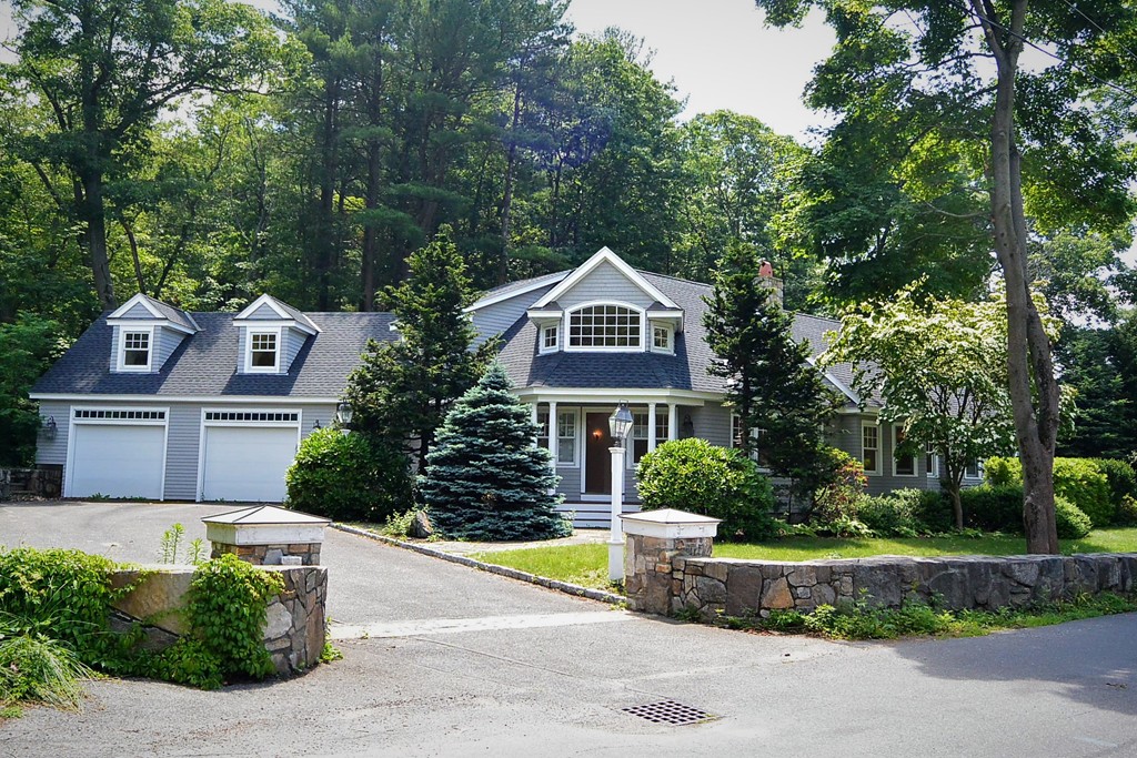 2 Prince Street Beverly, MA 01915 - Photo 1 of 30 a front view of a house with a garden