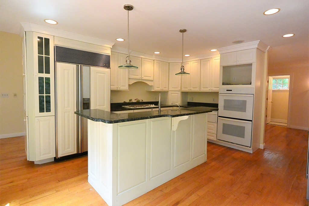 2 Prince Street Beverly, MA 01915 - Photo 14 of 30 a kitchen with stainless steel appliances granite countertop a refrigerator a sink and a stove