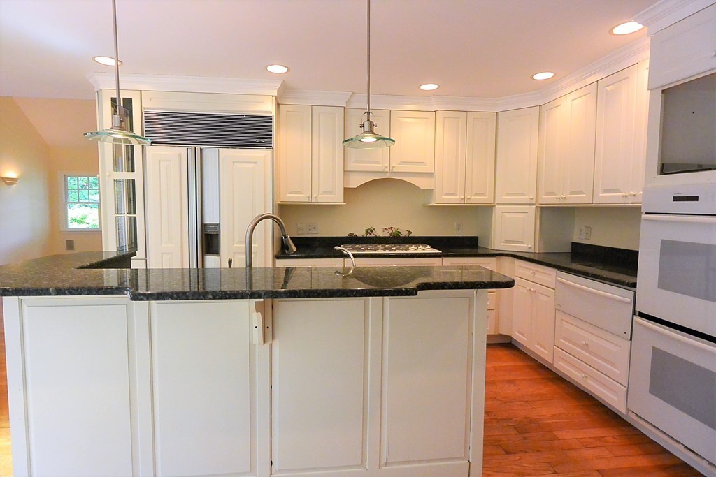 2 Prince Street Beverly, MA 01915 - Photo 16 of 30 a kitchen with stainless steel appliances granite countertop a sink a stove and a refrigerator