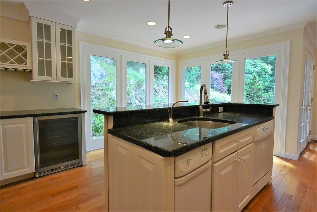 2 Prince Street Beverly, MA 01915 - Photo 17 of 30 a kitchen with granite countertop a sink a counter top space and cabinets