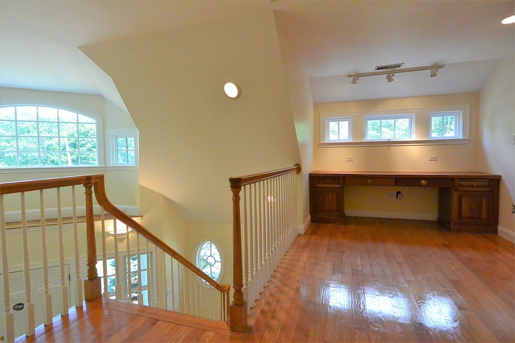 2 Prince Street Beverly, MA 01915 - Photo 21 of 30 a view of a hallway with a window and stairs