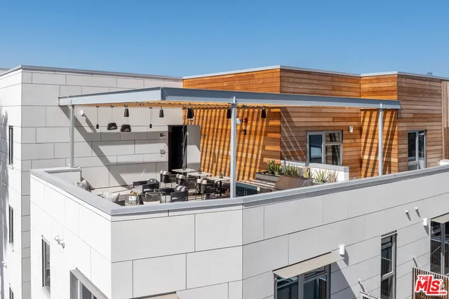 a front view of house with outdoor seating