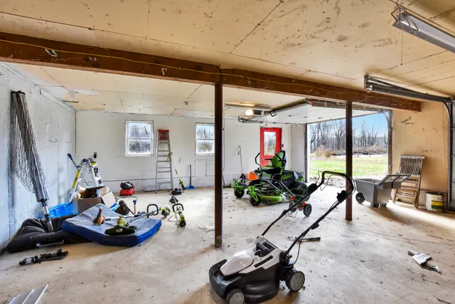 a view of a deck with furniture and garden