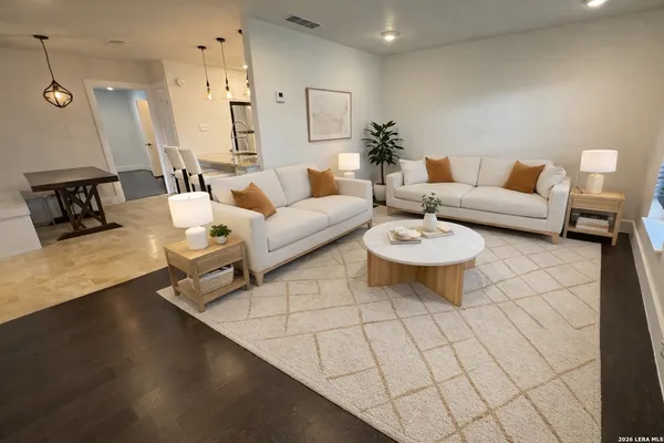 a living room with furniture and white walls