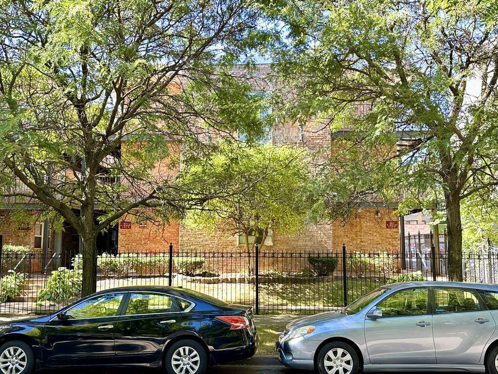 4616 North Beacon Street, Unit 2F Chicago, IL 60640 - Photo 1 of 21 a view of cars parked on the side of a street