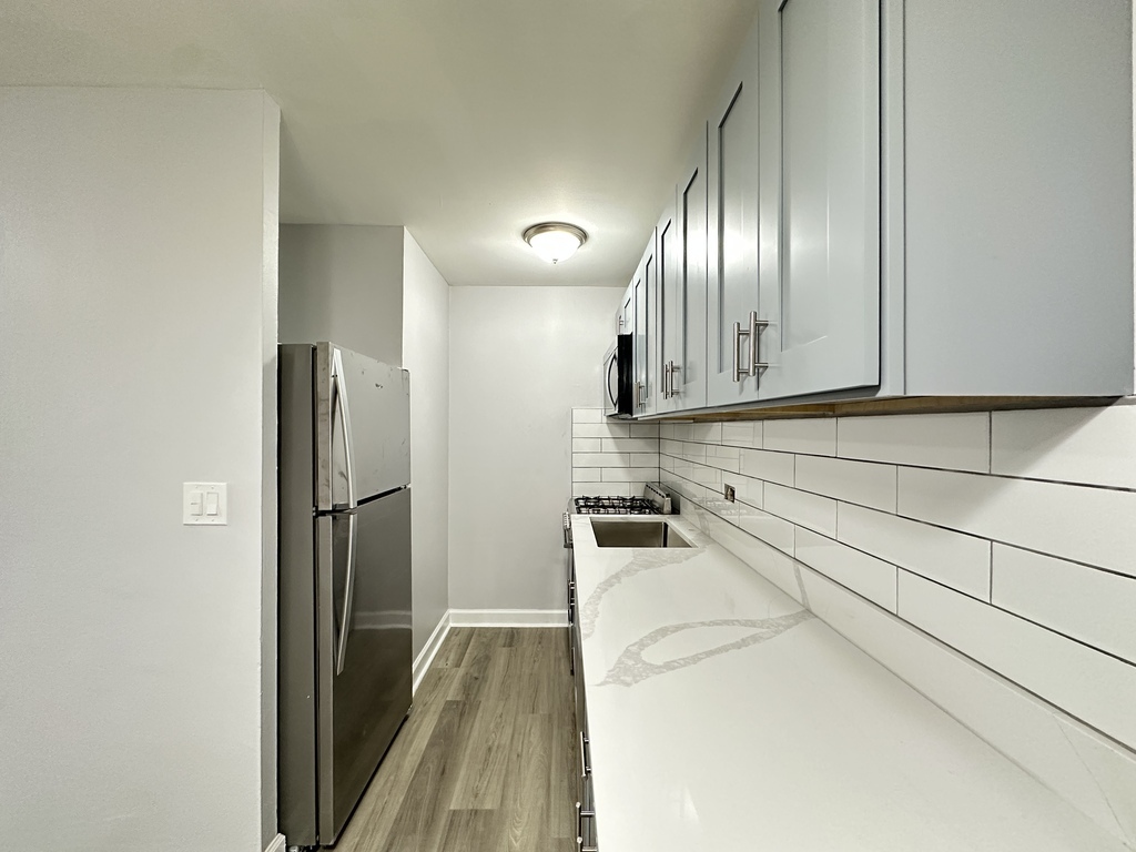4616 North Beacon Street, Unit 2F Chicago, IL 60640 - Photo 4 of 21 a view of a kitchen with a stove