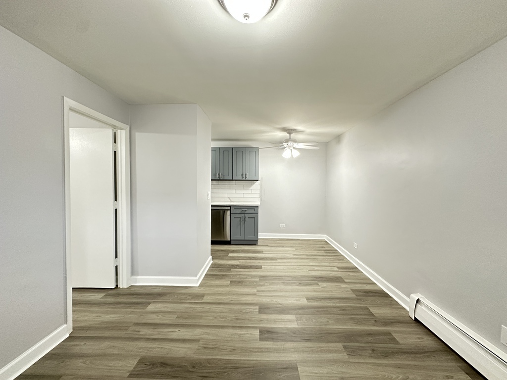 4616 North Beacon Street, Unit 2F Chicago, IL 60640 - Photo 10 of 21 a view of empty room with wooden floor