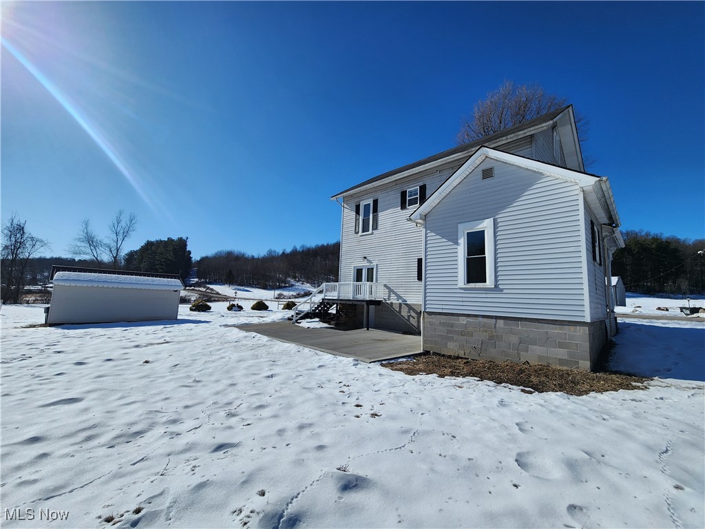 3163 Roxford Church Road Southeast Dennison, OH 44621 - Photo 5 of 39 Back of house with back patio