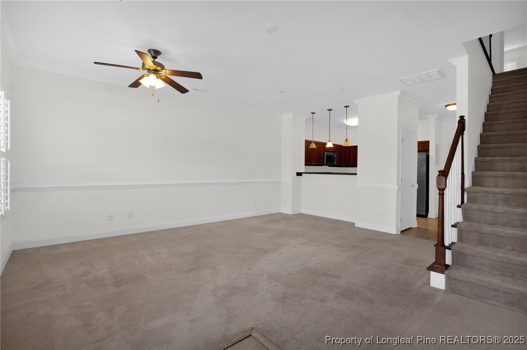 28 Hunter's Run Avenue Pembroke, NC 28372 - Photo 13 of 32 a view of a livingroom with a ceiling fan and window