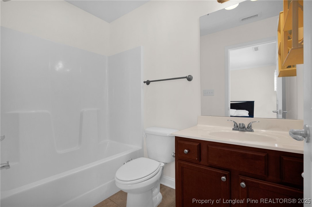 28 Hunter's Run Avenue Pembroke, NC 28372 - Photo 24 of 32 a bathroom with a sink a toilet and shower