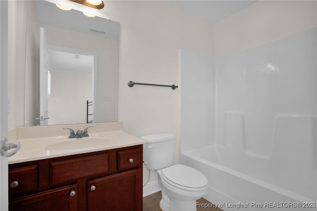 28 Hunter's Run Avenue Pembroke, NC 28372 - Photo 29 of 32 a bathroom with a sink toilet and shower