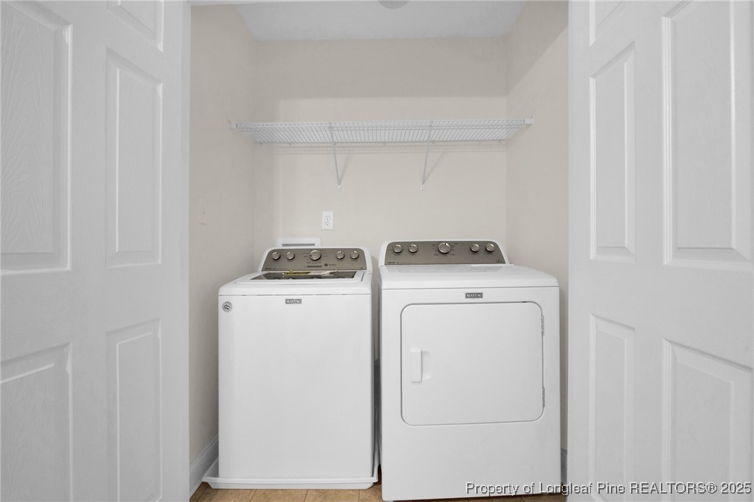 28 Hunter's Run Avenue Pembroke, NC 28372 - Photo 31 of 32 a utility room with dryer and washer