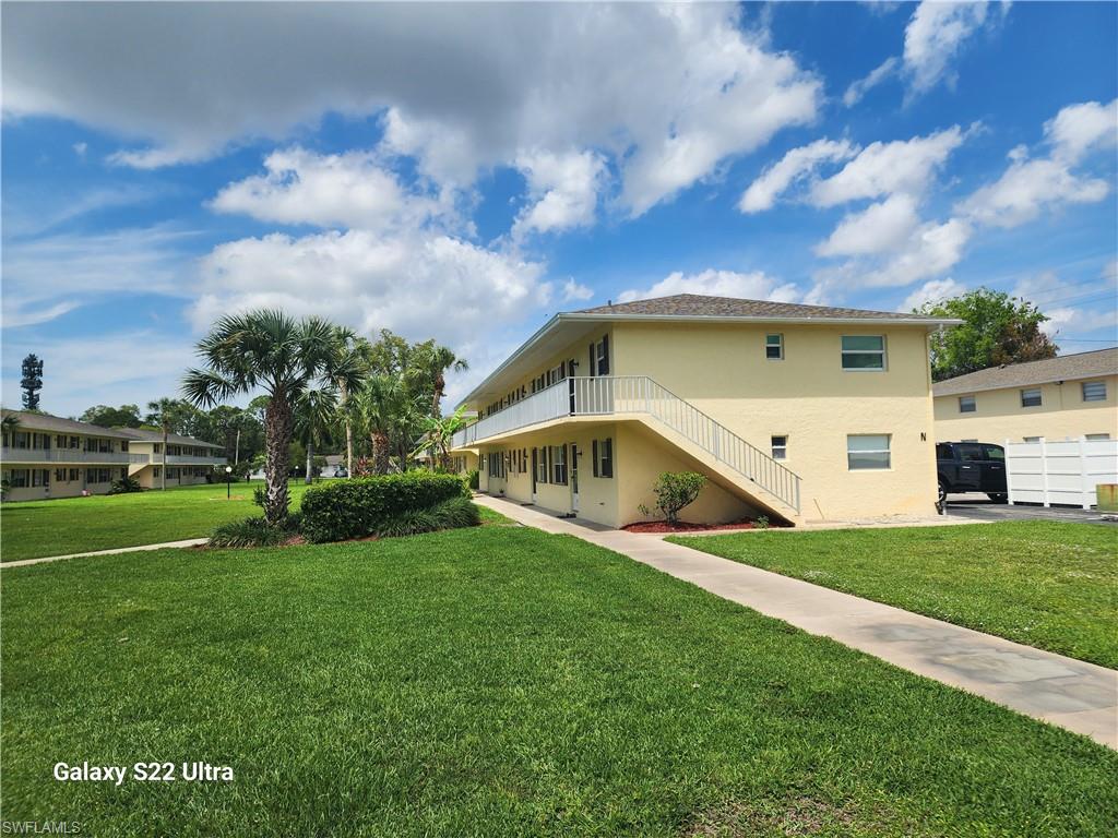 3325 Airport Road North, Unit N8 Naples, FL 34105 - Photo 3 of 22 a view of an house with backyard and entertaining space
