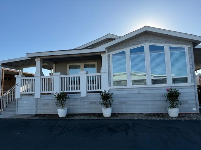 3418 North Waring Road, Unit 92 Denair, CA 95316 - Photo 1 of 1 a front view of a house with garden