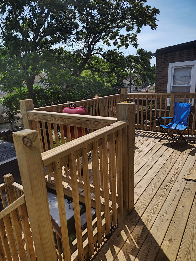1051 North Springfield Avenue Chicago, IL 60651 - Photo 13 of 50 a view of balcony with wooden floor and seating space