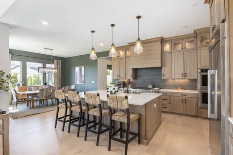 a kitchen with sink cabinets and living room