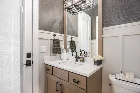 a bathroom with a sink a mirror and a bathtub