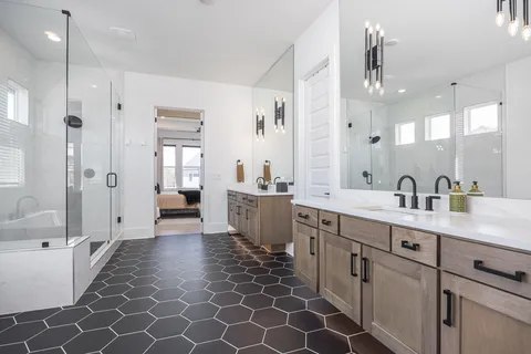 a work room with furniture a rug and white walls