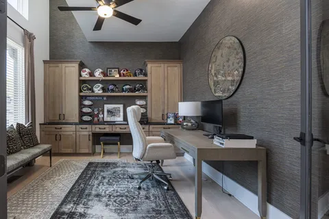a bedroom with bed and a chandelier