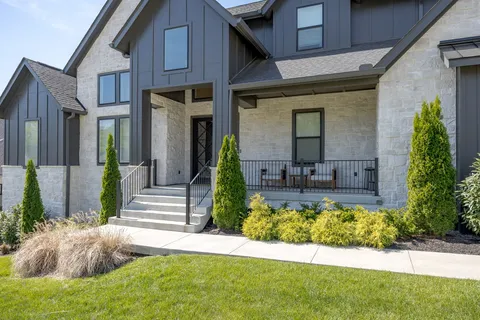 a front view of a house with garden