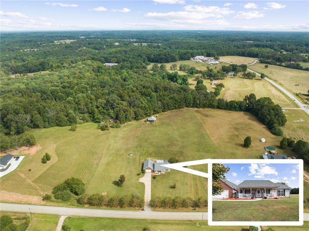 114 Reggie Ingram Road Commerce, GA 30530 - Photo 1 of 1 an aerial view of residential houses with outdoor space