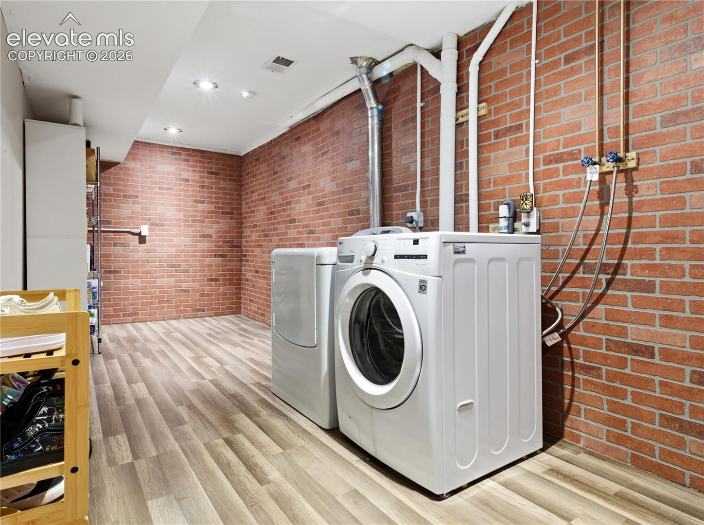 329 Raspberry Lane Monument, CO 80132 - Photo 22 of 25 Laundry room off the garage flooring, recessed lighting, and a drop ceiling