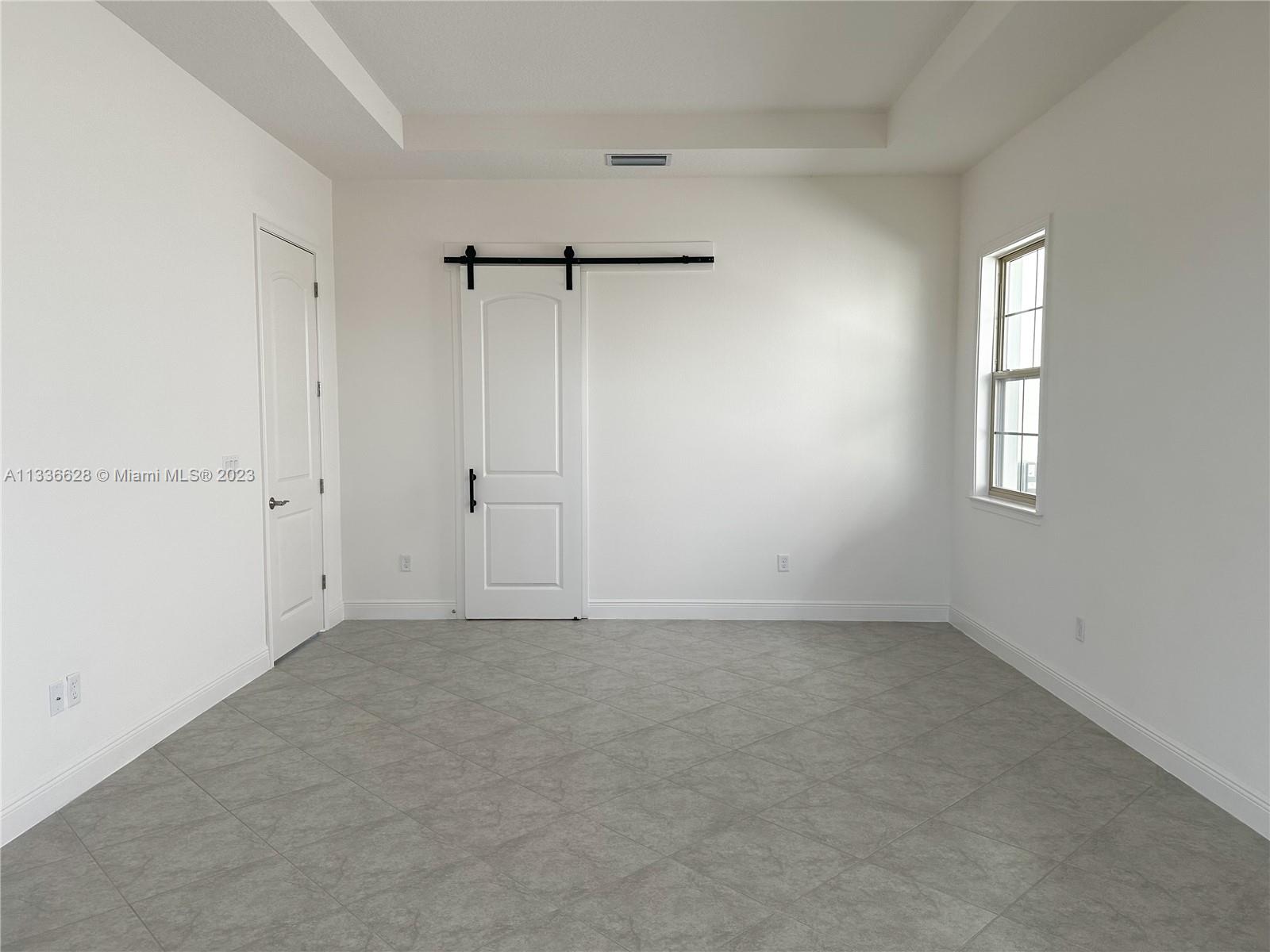 13646 Abberwick Drive Orlando, FL 32832 - Photo 15 of 50 a view of an empty room with a window