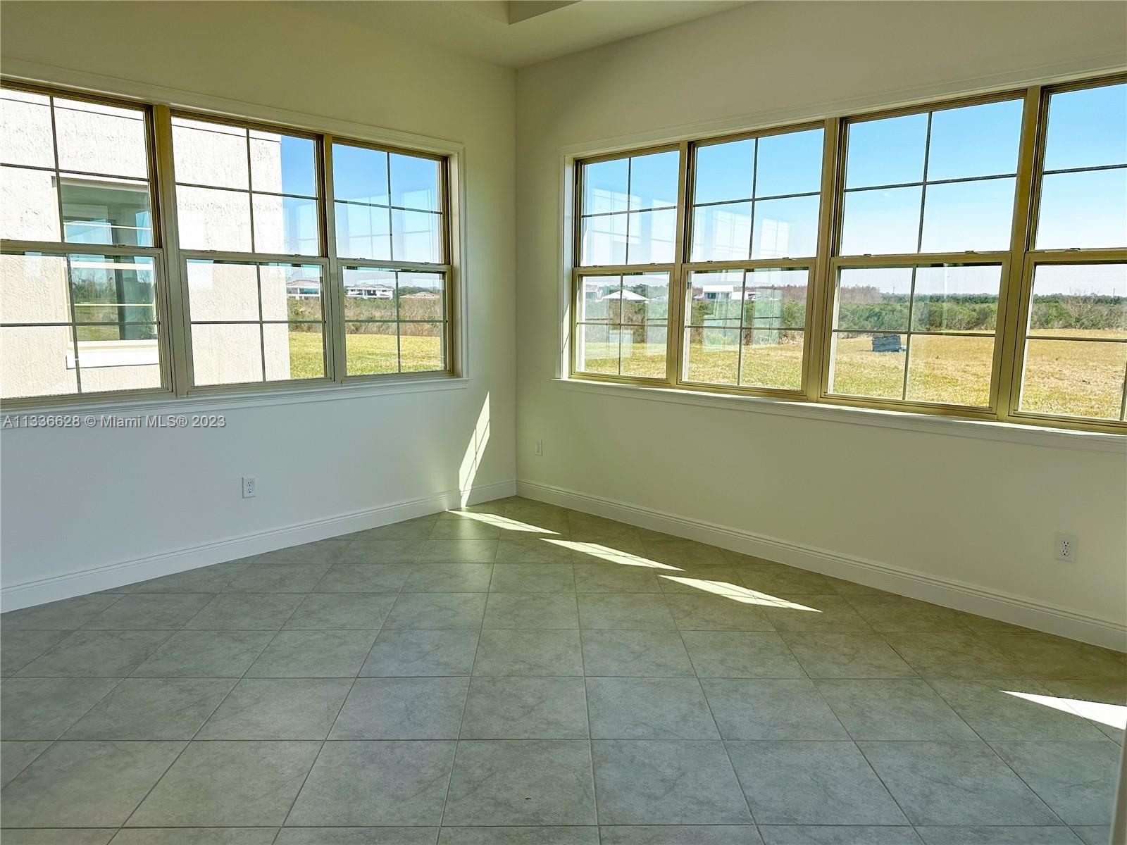 13646 Abberwick Drive Orlando, FL 32832 - Photo 20 of 50 a view of an empty room with a window