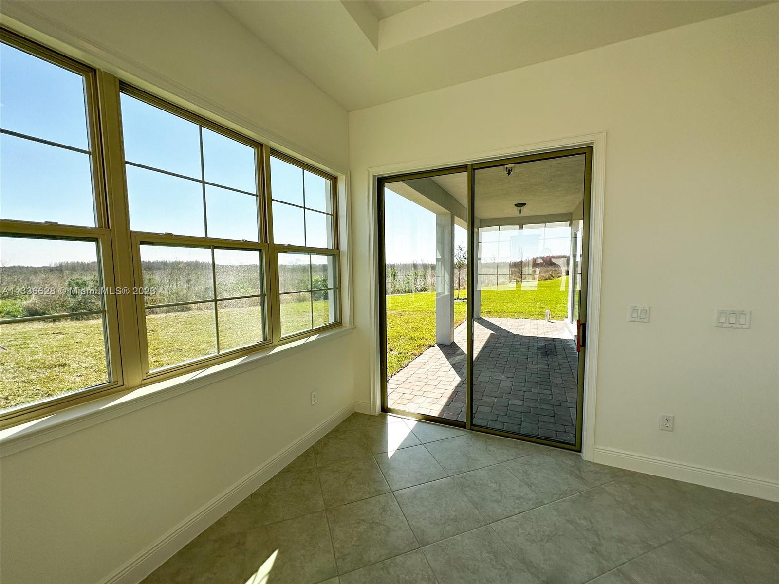 13646 Abberwick Drive Orlando, FL 32832 - Photo 21 of 50 a view of an empty room with a window