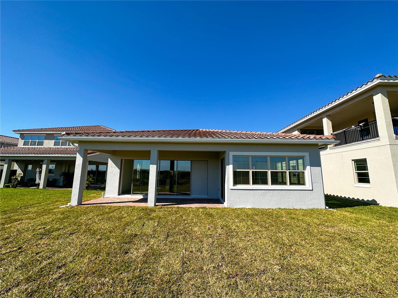 13646 Abberwick Drive Orlando, FL 32832 - Photo 26 of 50 front view of a house with a small yard