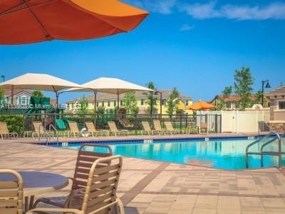 13646 Abberwick Drive Orlando, FL 32832 - Photo 29 of 50 a view of a house with a yard and potted plants