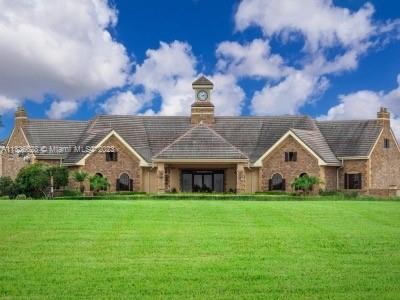 13646 Abberwick Drive Orlando, FL 32832 - Photo 36 of 50 a front view of a house with garden