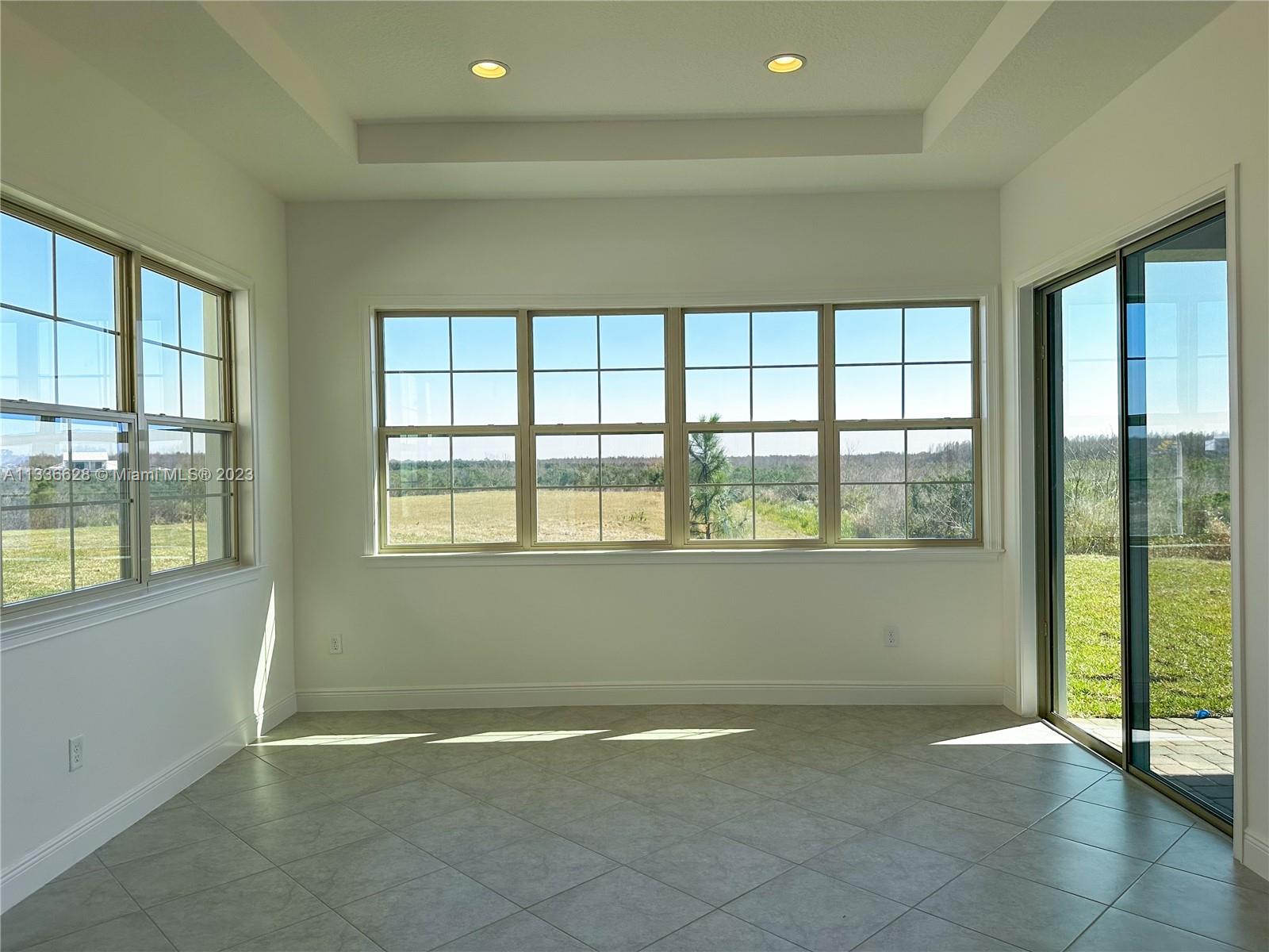 13646 Abberwick Drive Orlando, FL 32832 - Photo 4 of 50 a view of an empty room with a window