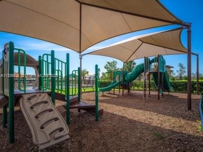 13646 Abberwick Drive Orlando, FL 32832 - Photo 42 of 50 a view of a backyard with swimming pool and sitting area