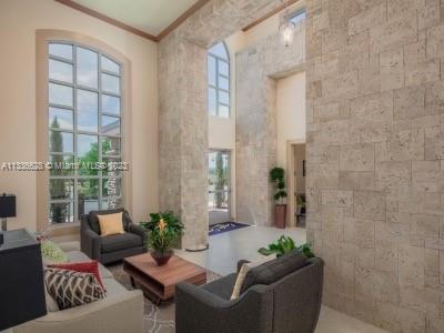 13646 Abberwick Drive Orlando, FL 32832 - Photo 48 of 50 a living room with furniture and a potted plant